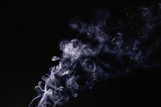 Wavy smoke on black background