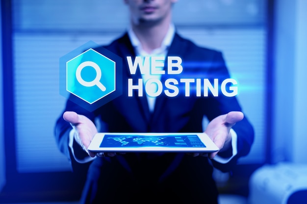 Website hosting concept with man holding tablet