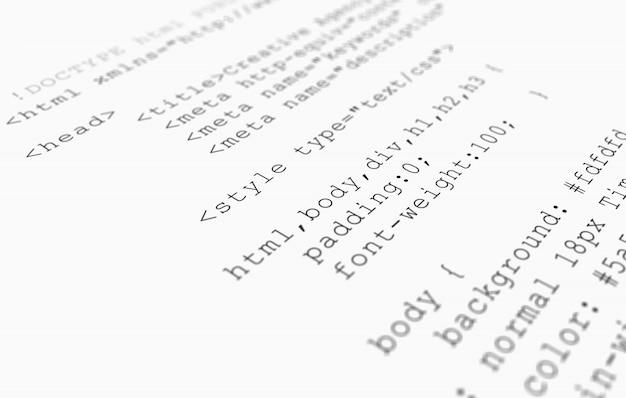 Website HTML code browser view printed on white paper, closeup view.