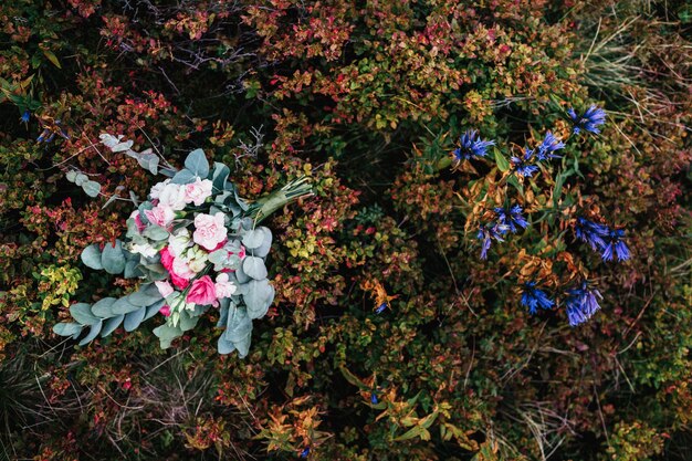 Wedding bouquet lies on the grass