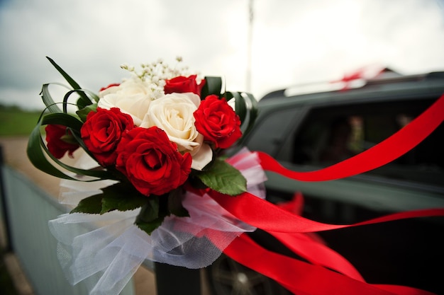 Free photo wedding bouquet with red tape