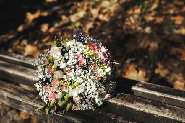 Wedding bouquet on a wooden bench