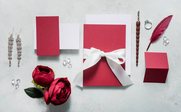 Wedding card with engagement ring on table