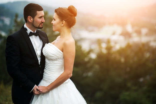 Wedding couple in nature , the city away