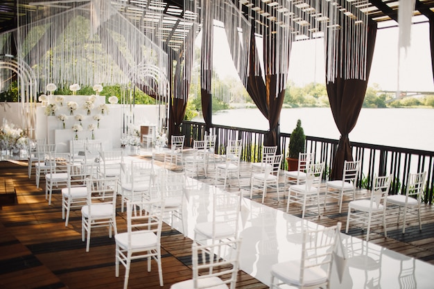 Free photo wedding hall with a view on a lake