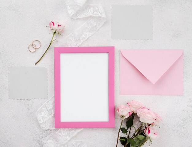 Wedding invitation card with frame on the table