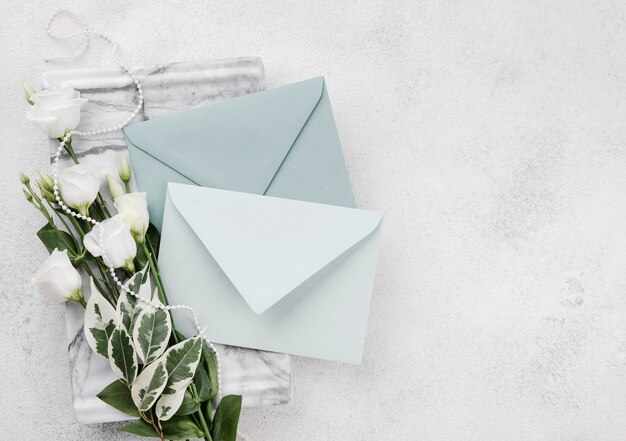 Wedding invitation cards with flowers on the table