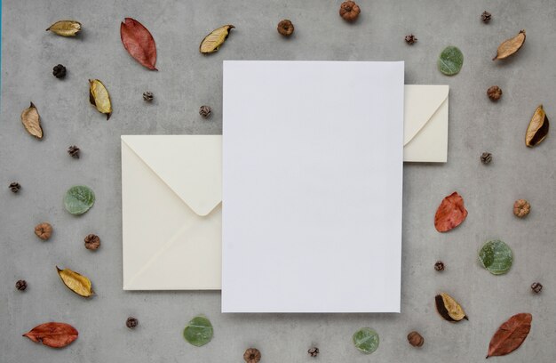 Wedding invitation surrounded by leaves