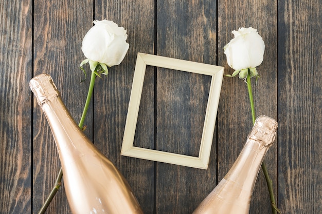 Free photo wedding ornaments with champagne bottle