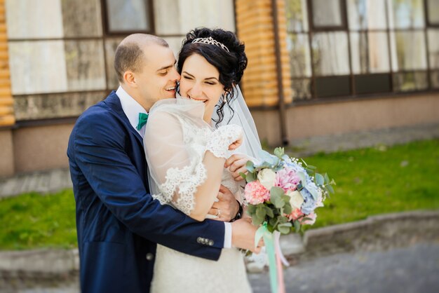 Wedding. Wedding day. Beautiful bride and elegant groom walking after wedding ceremony.