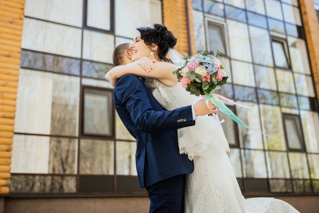 Wedding. Wedding day. Beautiful bride and elegant groom walking after wedding ceremony