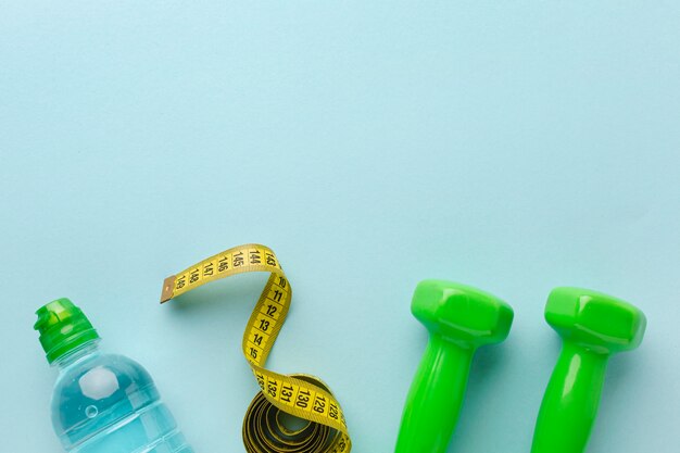 Weights meter and bottle of water with copy space