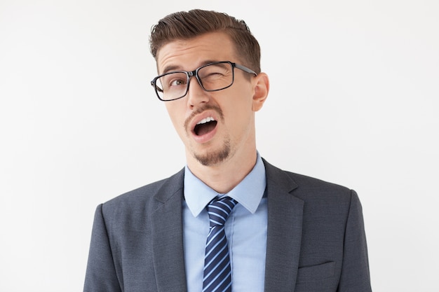 Free photo weird middle-aged boss in glasses winking