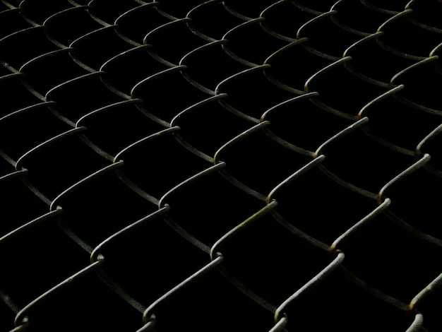 Free photo welded mesh fence at night