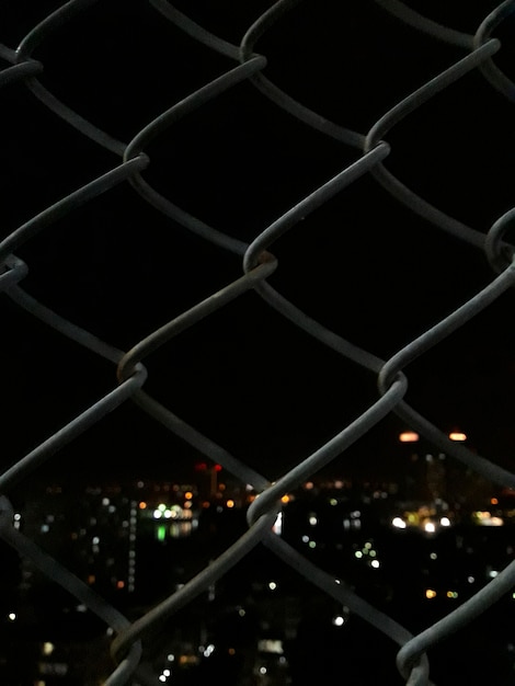 Welded mesh fence with night view