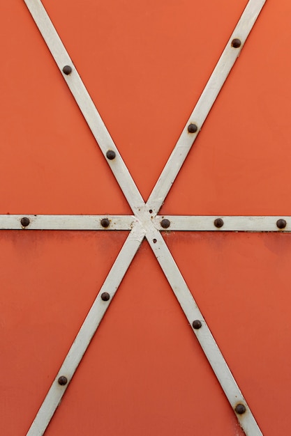 Welded metal strips with rusty rivets