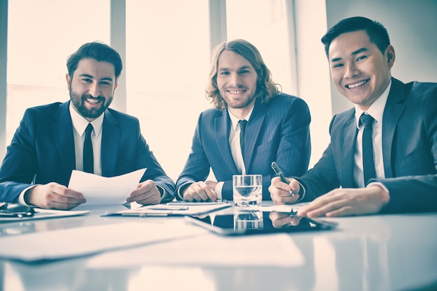 Well-dressed businessmen at a meeting