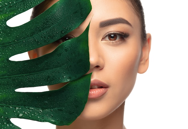 Well-kept. portrait of beautiful young woman on white studio background. concept of cosmetics, makeup, natural and eco treatment, skin care. shiny and healthy look, fashion, healthcare. copyspace.