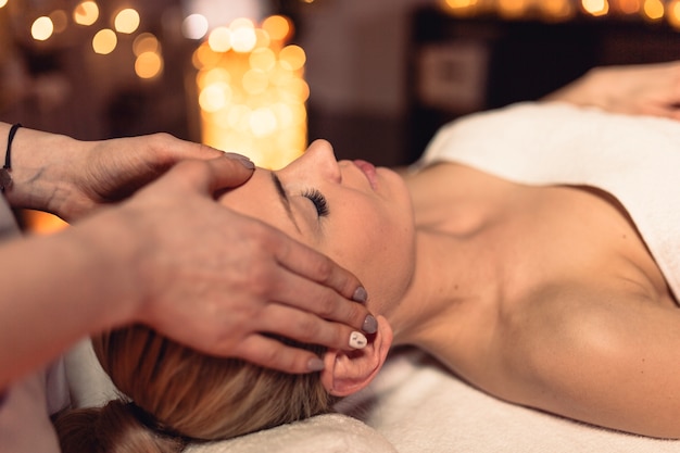 Wellness concept with woman in massage salon