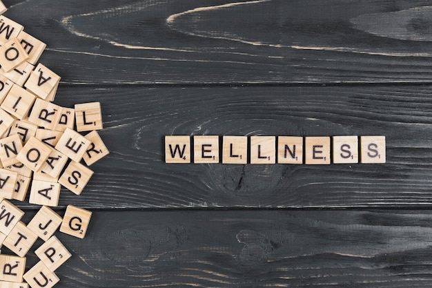 Wellness word on wooden background