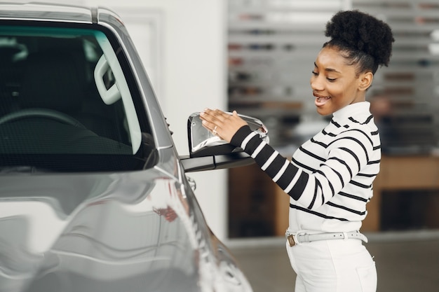 Free photo went shopping today. shot of an attractive african woman shooses a car.