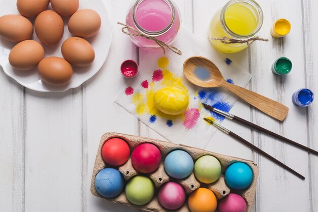 Wet brushes near colored eggs