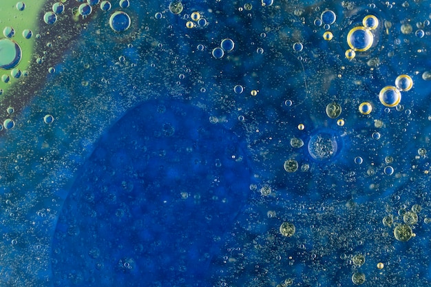 Wet bubbles over the dark blue background