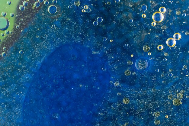 Wet bubbles over the dark blue background