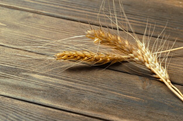 Wheat Ears on the Wooden Table