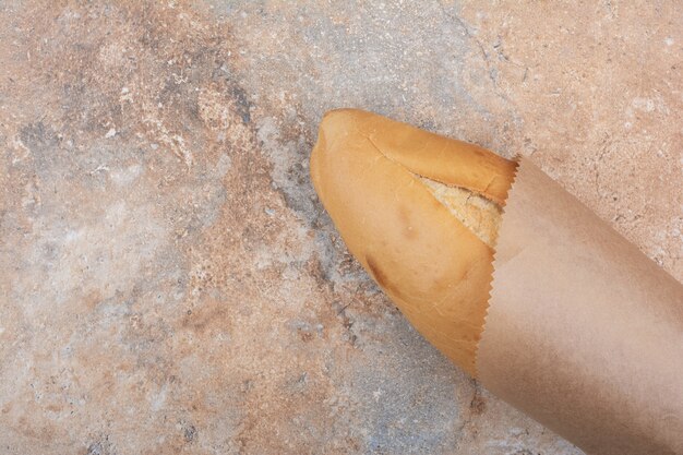 Wheat loaf bread on marble surface