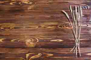 Free photo wheat on wooden surface