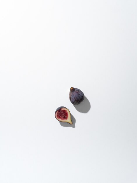 While fig and a half isolated on a white surface