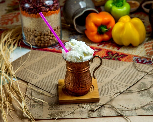 Whipped ayran in iron cup