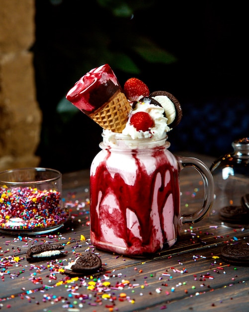 Whipped cream with strawberries ice cream and oreo cookies