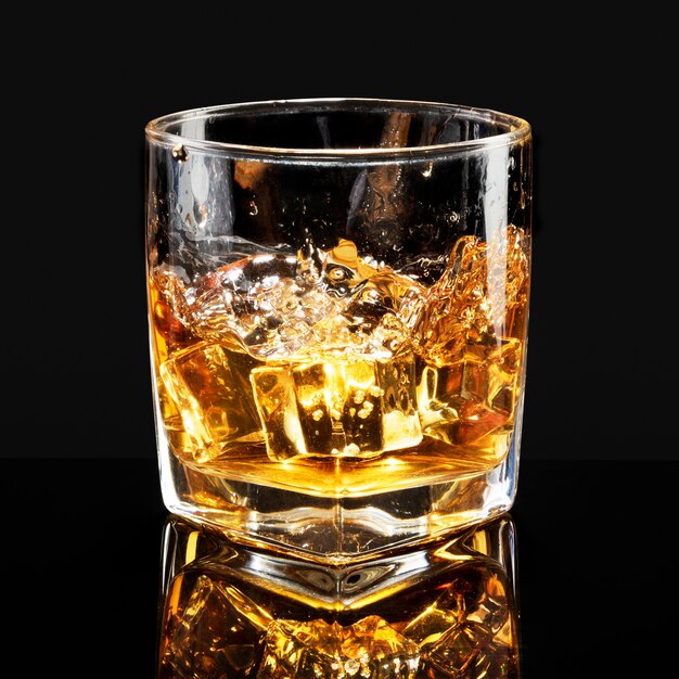 Whiskey on the rocks black background