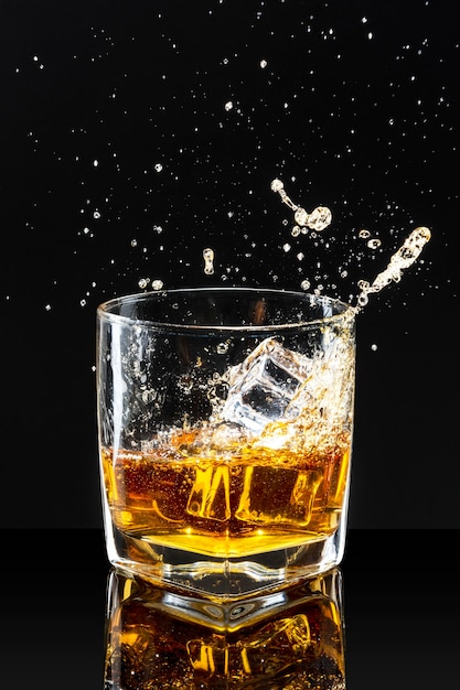 Whiskey on the rocks black background