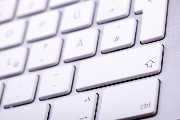 White aluminum keyboard in close up. Technology and communication