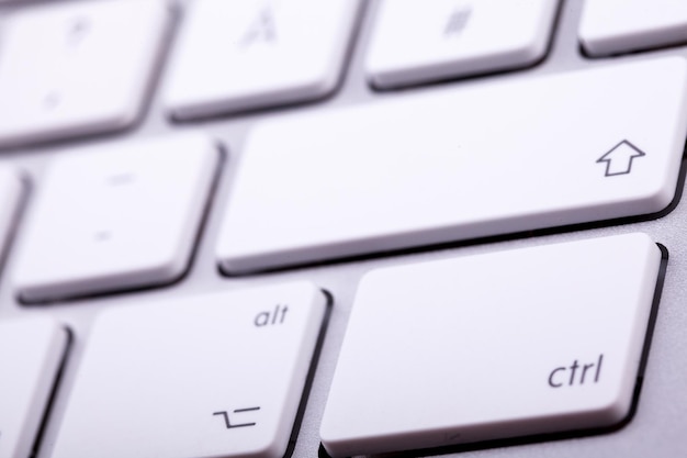 White aluminum keyboard in close up. Technology and communication