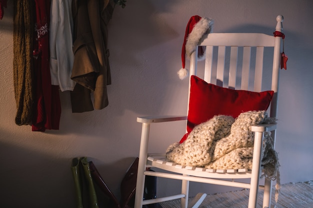 Free photo white armchair with a santa hat