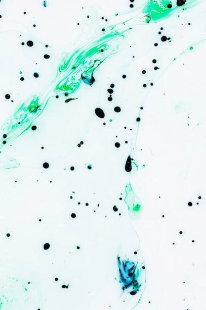 White background with colourful ink drops