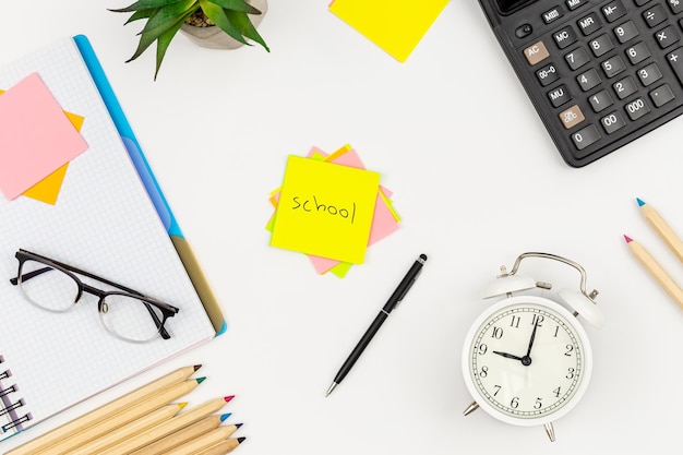 Free photo white background with school supplies top view