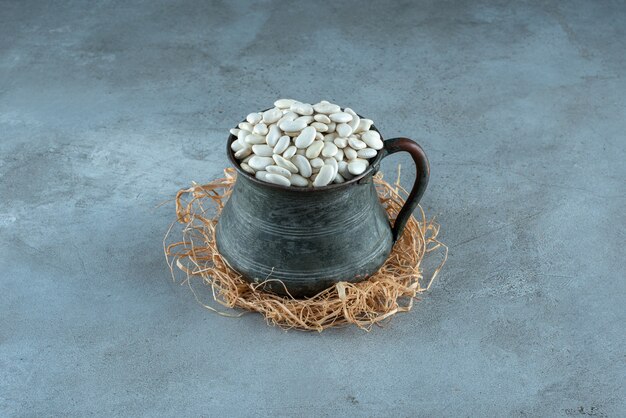 White beans in an ethnic metallic pot. High quality photo