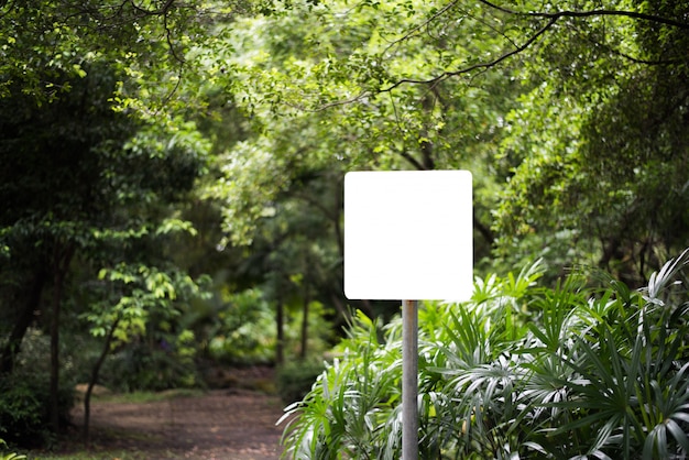 White blank billboard in the park with nature background. 