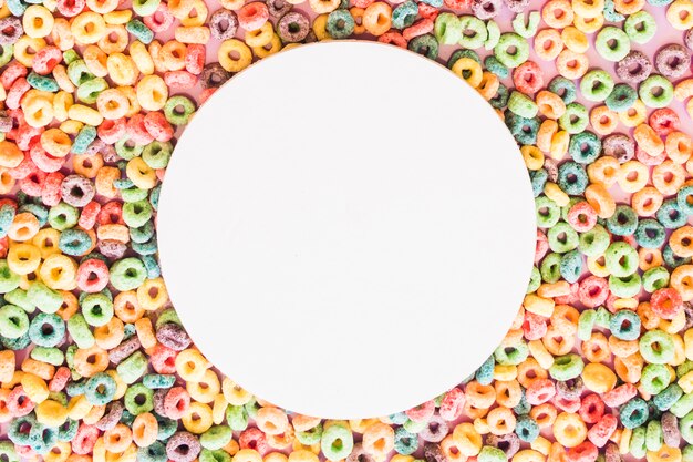 White blank round frame on the colorful cereal loop rings backdrop