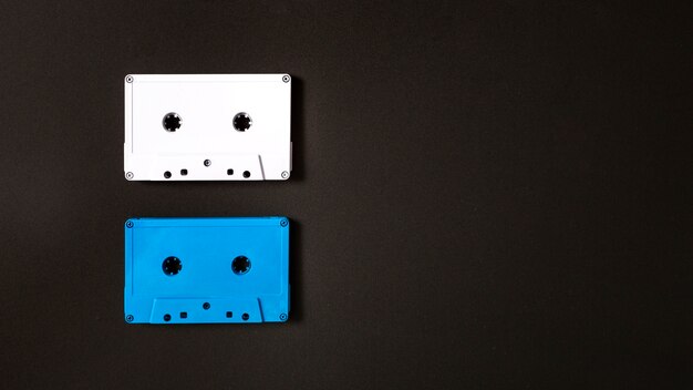 White and blue cassette tape on black background