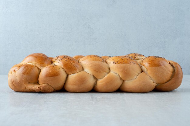 White braided bread on stone