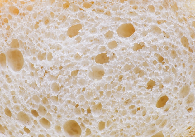 Белый хлеб крошки экстремальных крупным планом
