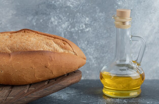 white bread with oil on the wooden board. high quality photo