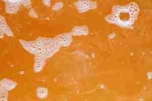 Free photo white bubbles on orange water