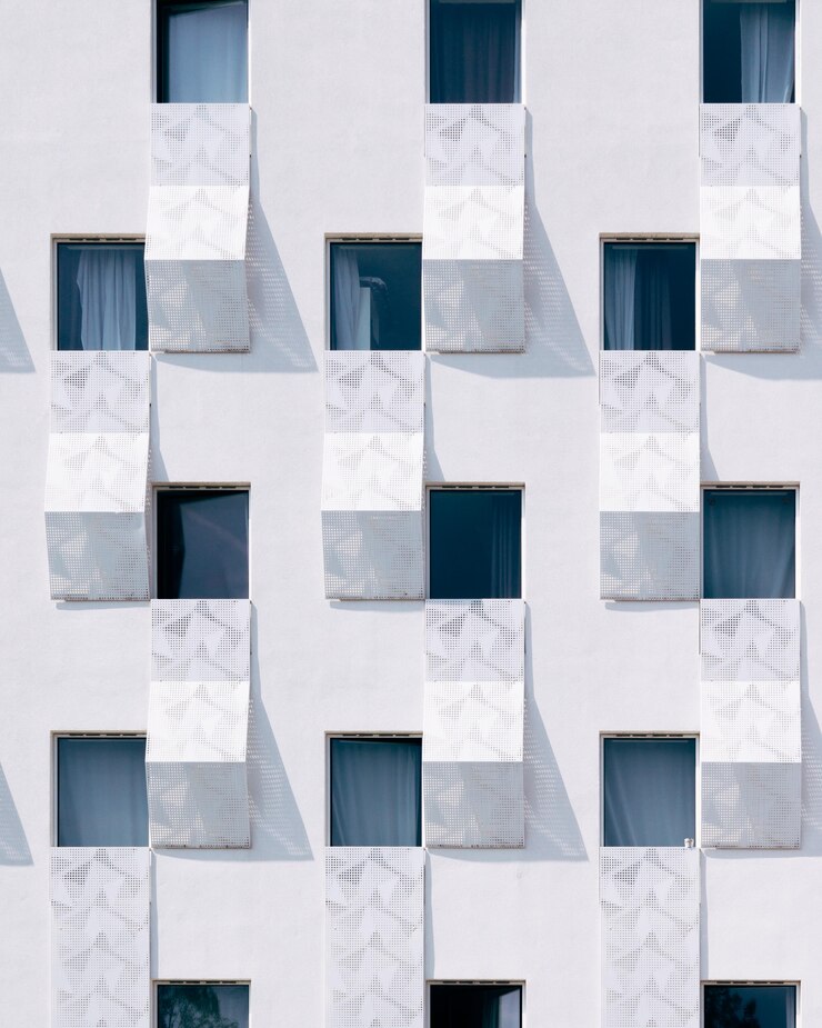 Free Photo white building with blue windows
